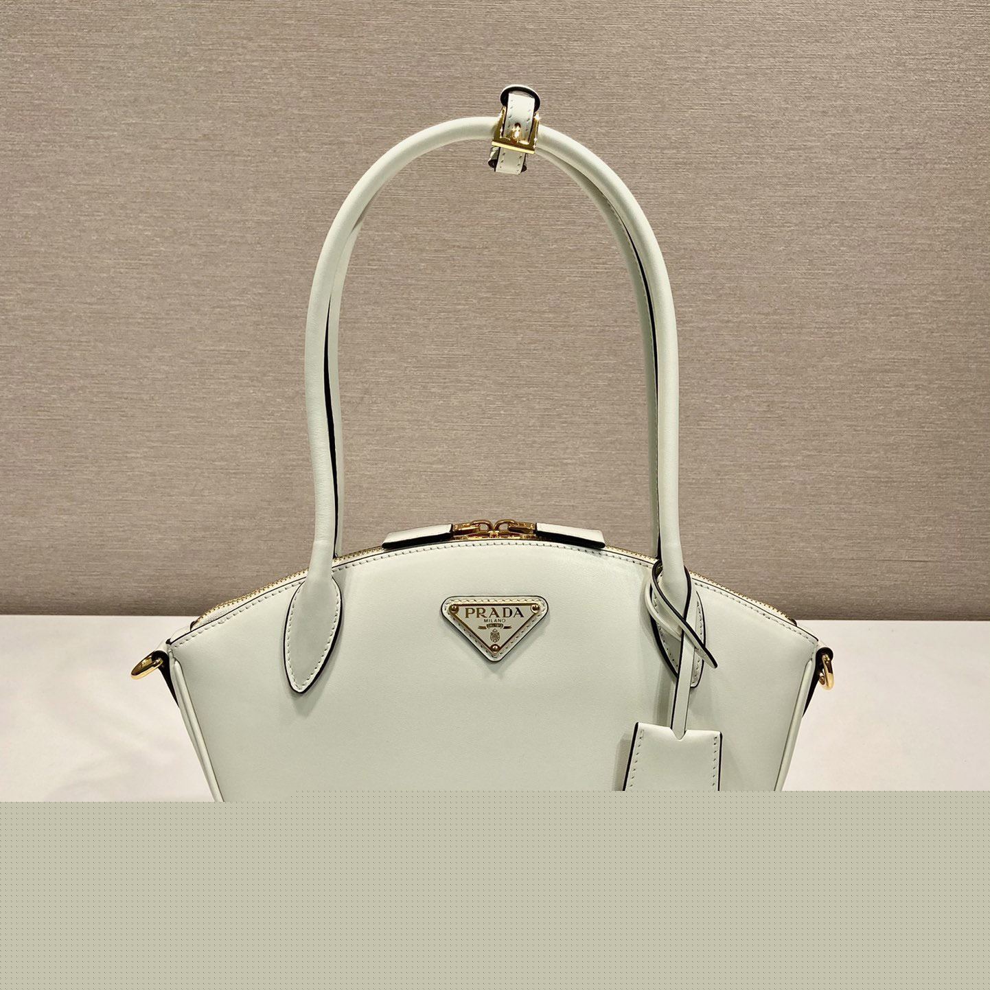 Pra*a top handle bags